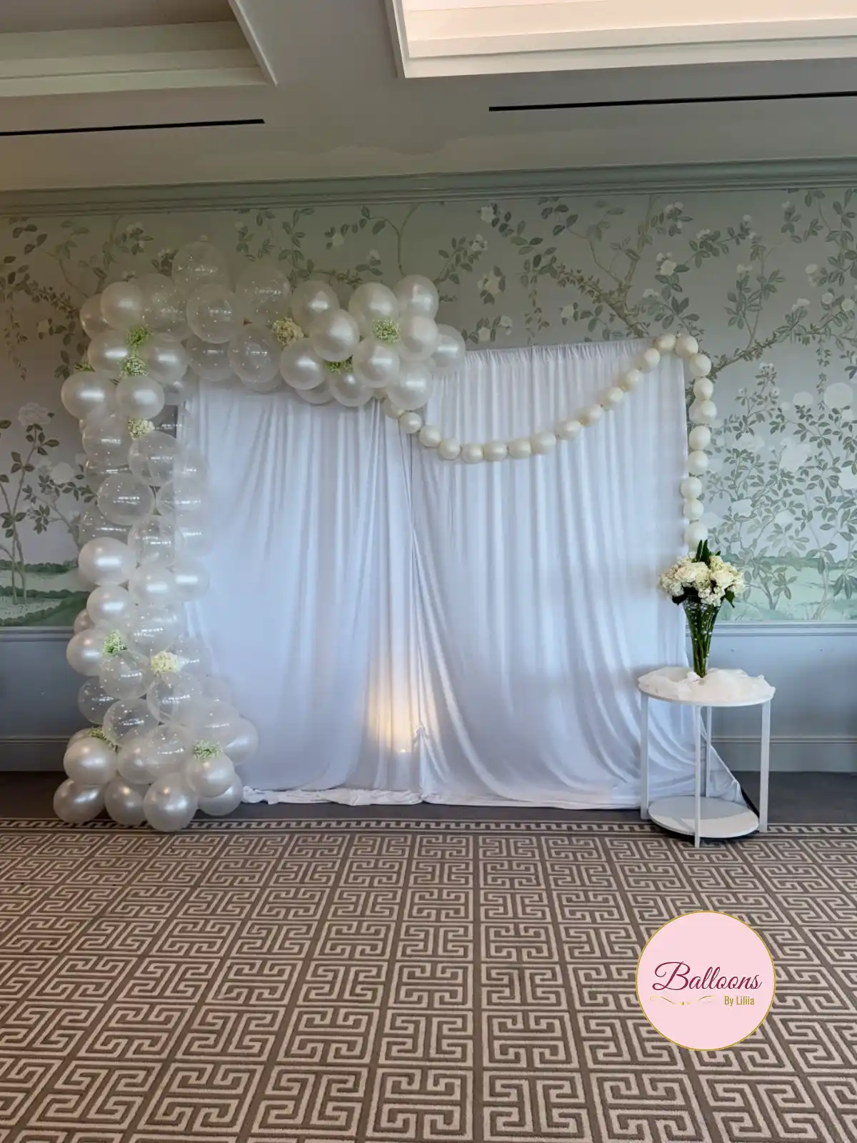Champagne and ivory organic balloon arch at a Jersey City wedding