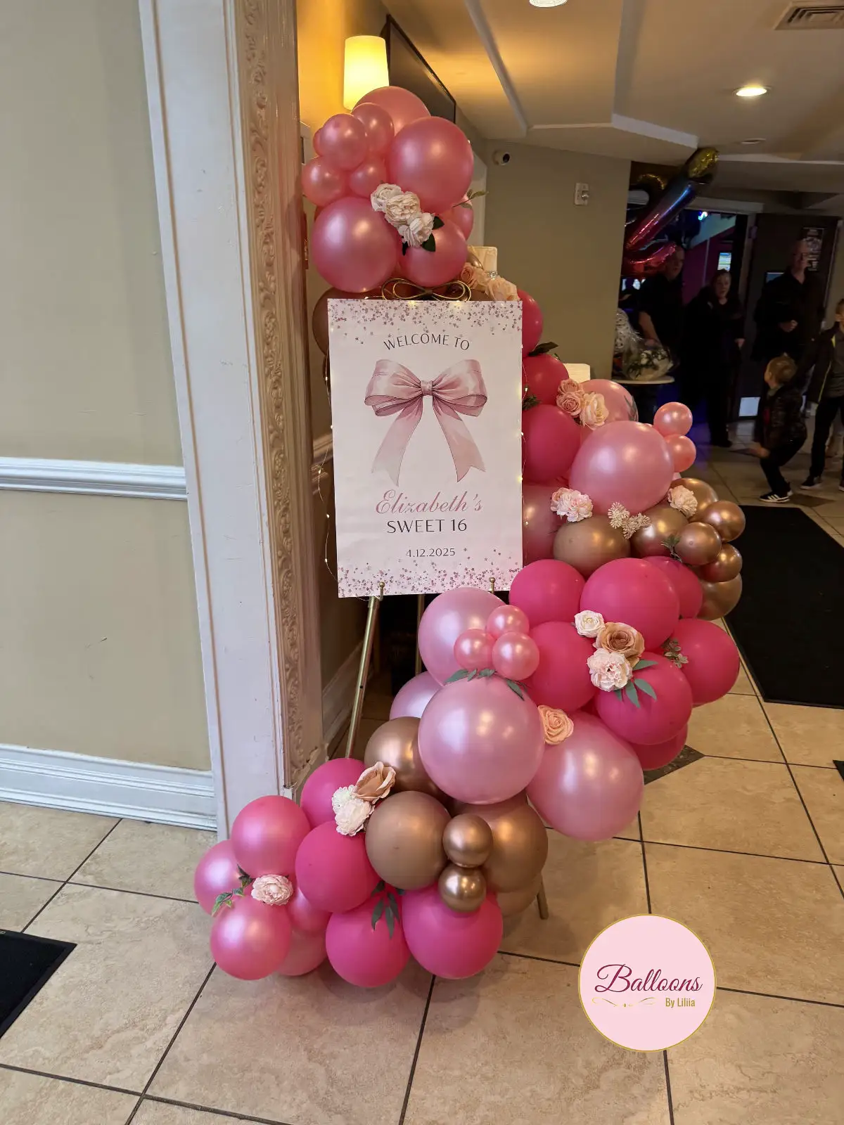 Pink organic balloon garland inspiration for brand colors and themed displays