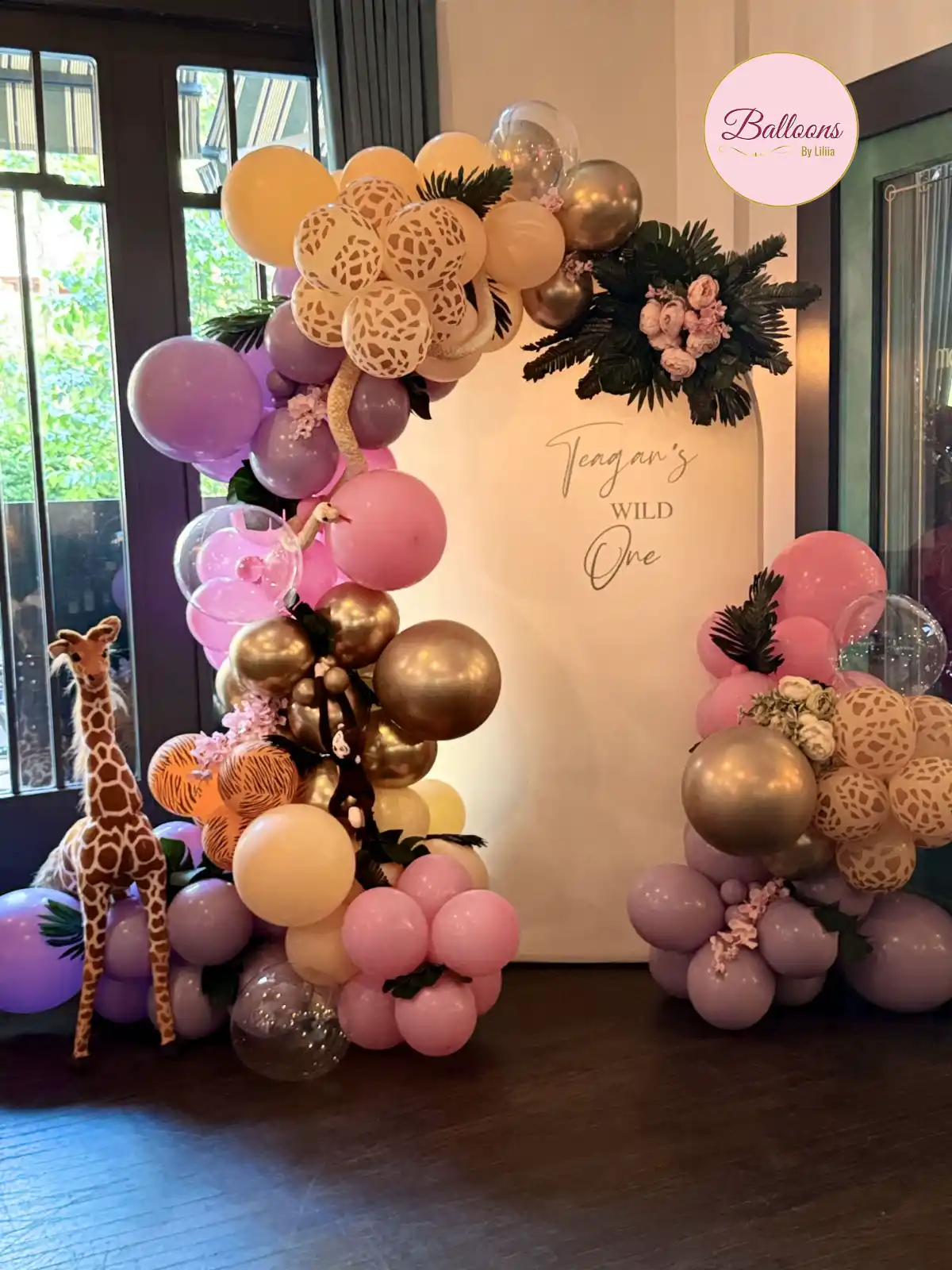 Organic balloon arch showing layered color and custom theme styling